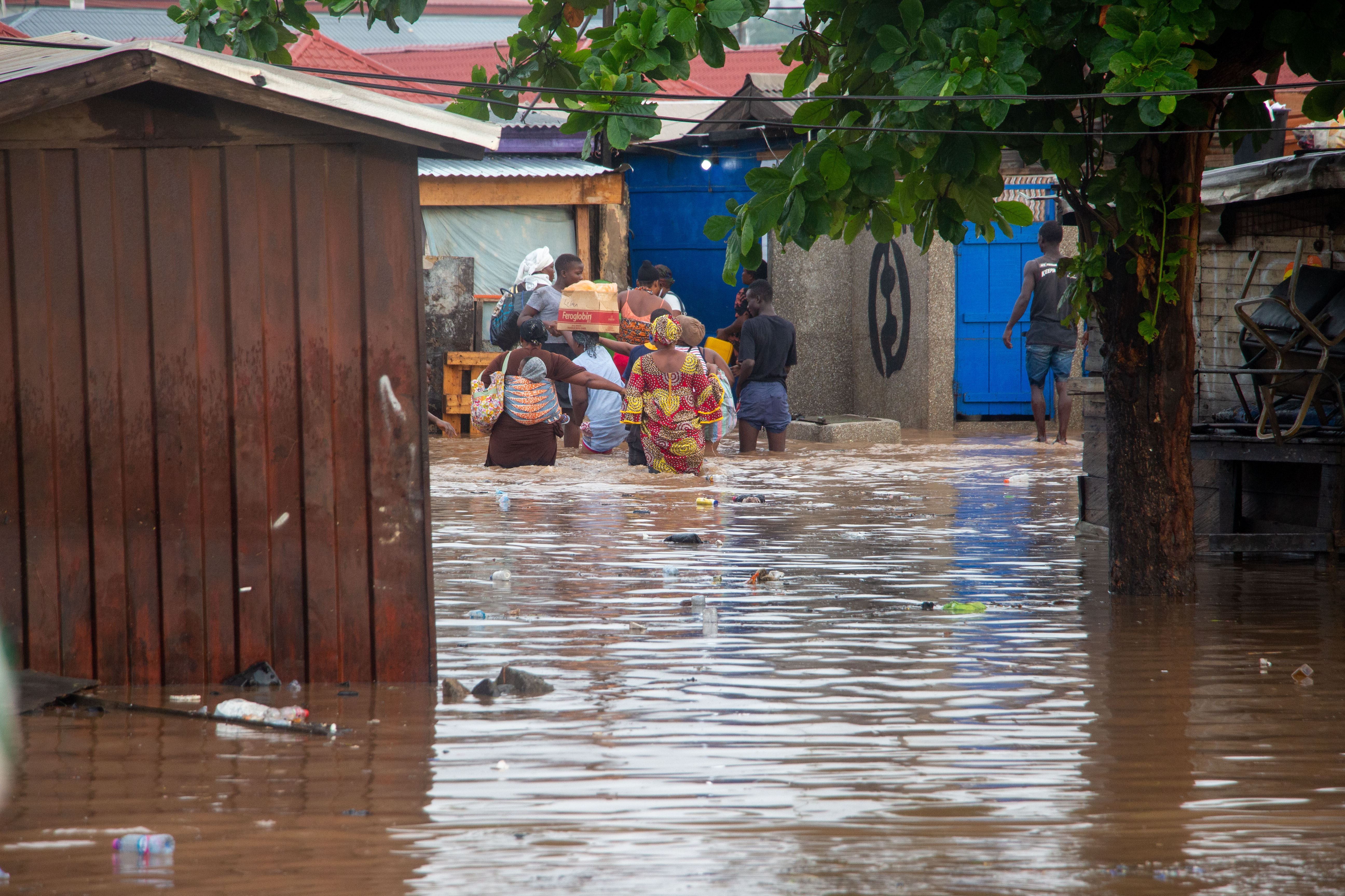 Persons struggling with floods
